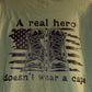 A Real Hero Does not Wear a Cape T-shirt: Black Design